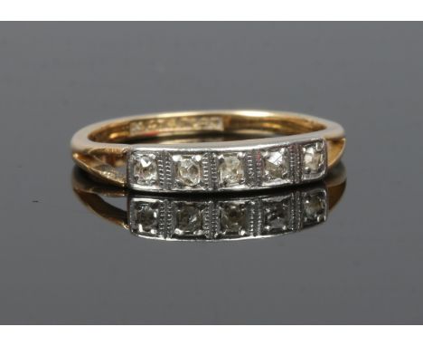A 9ct gold and platinum ring set with five line cut diamonds, size O.