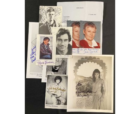 JAMES BOND - A group of autographed related to James Bond comprising PIERCE BROSNAN, TIMOTHY DALTON, JUDI DENCH x 2 plus lett