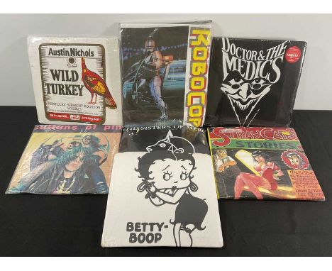 A group of vintage merchandise T-Shirts, still sealed in original packaging comprising of ROBOCOP, SULTANS OF PING, DOCTOR AN