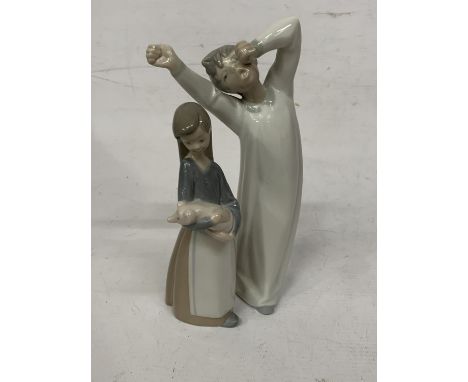 TWO LLADRO FIGURES - BOY YAWNING IN A NIGHTGOWN AND A GIRL HOLDING A PIG 