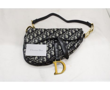 A FASHION HANDBAG MARKED CHRISTIAN DIOR WITH CARD 