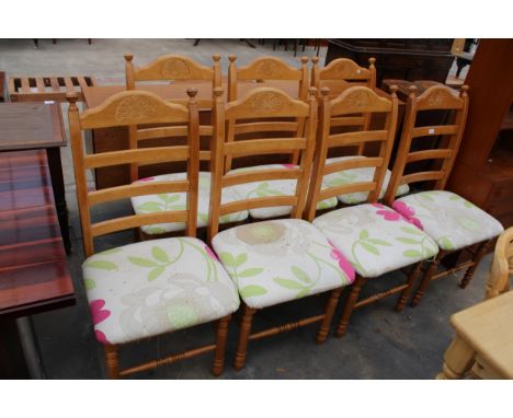 A SET OF SEVEN MODERN HARDWOOD LADDER-BACK DINING CHAIRS 