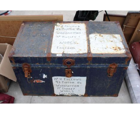 A VINTAGE METAL TRAVEL TRUNK 