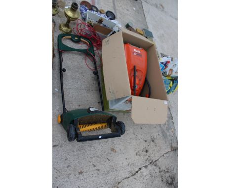 A FLYMO POWER COMPACT 330 LAWN MOWER AND AN ELECTRIC LAWN RAKE 