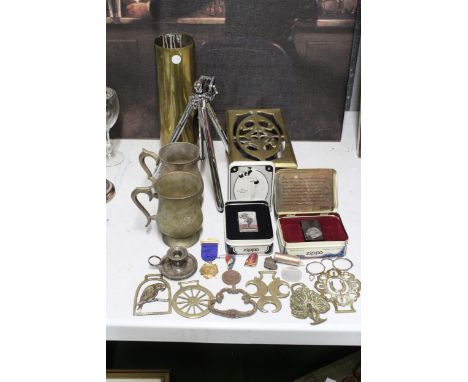 A MIXED LOT TO INCLUDE TWO BOXED ZIPPO LIGHTERS, BRASS TANKARDS, TRIPOD, SHELL CASE, BRASS PAN STAND, ETC., 