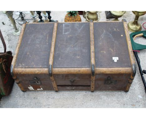 A VINTAGE COMPRESSED FIBRE TRAVEL TRUNK 