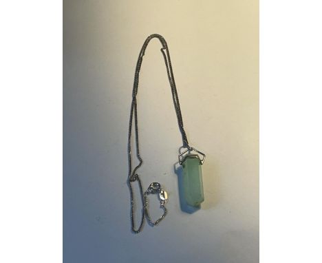 A JADE CRYSTAL PENDANT ON A 925 SILVER CHAIN 