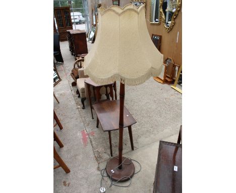 A SMALL OAK COFFEE TABLE AND STANDARD LAMP WITH SHADE 