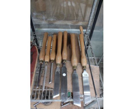 AN ASSORTMENT OF EIGHT LARGE WOODEN HANDLE LATHE TOOLS AND CHISELS 