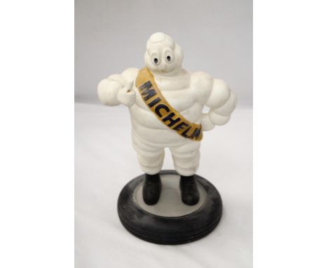 A VINTAGE MICHELIN MAN ON TYRE APPROXIMATELY 33 CM HIGH 