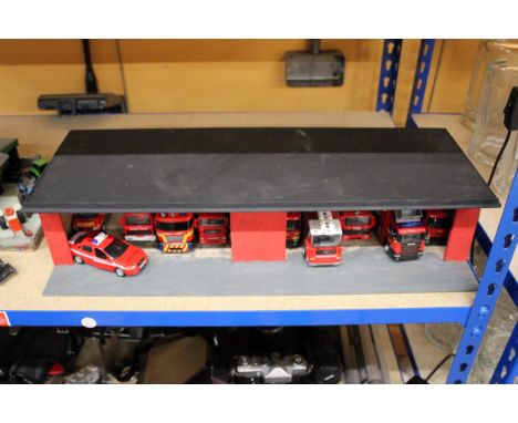 A FIRE STATION WITH ELEVEN MODEL FIRE ENGINES 