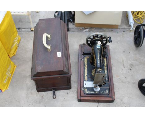 A VINTAGE SINGER SEWING MACHINE WITH WOODEN CARRY CASE 