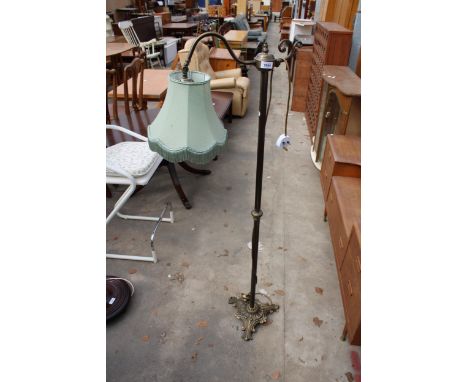 A VICTORIAN STYLE READING STANDARD LAMP ON BRASS COLUMN AND BASE WITH SHADE 