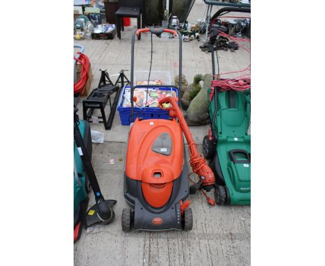 A ROLLER COMPACT 400 FLYMO LAWN MOWER AND AN ELECTRIC BLACK AND DECKER GRASS STRIMMER 