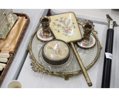 A VINTAGE 'PETIT-POINT' DRESSING TABLE SET TO INCLUDE, CANDLESTICKS, A HAND MIRROR, LIDDED TRINKET JAR AND TRAY 