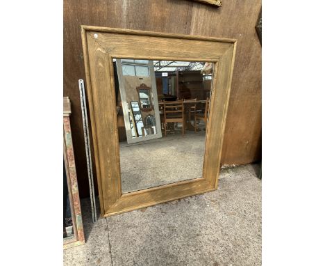 A RECTANGULAR OAK FRAMED WALL MIRROR, 51" X 42" 
