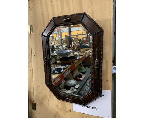 A LARGE ANTIQUE CARVED WOOD OCTAGONAL PORTRAIT MIRROR 