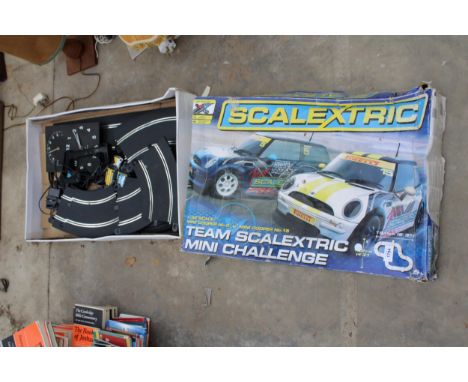 A SCALEXTRIC SET COMPLETE WITH TWO CARS 