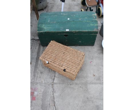 A VINTAGE WOODEN STORAGE TRUNK AND A WICKER HAMPER BASKET 