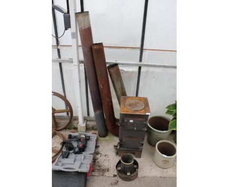 A VINTAGE STOVE WITH FLU PIPE 