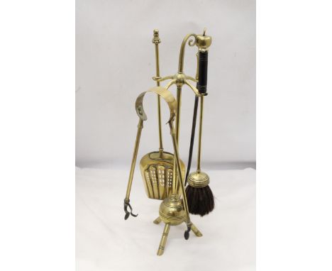 A 1930'S TRIPOD BRASS COMPANION SET 