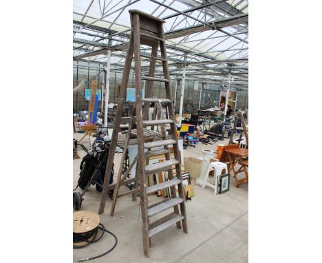 A VINTAGE TEN RUNG WOODEN STEP LADDER AND A FURTHER FIVE RUNG WOODEN STEP LADDER 