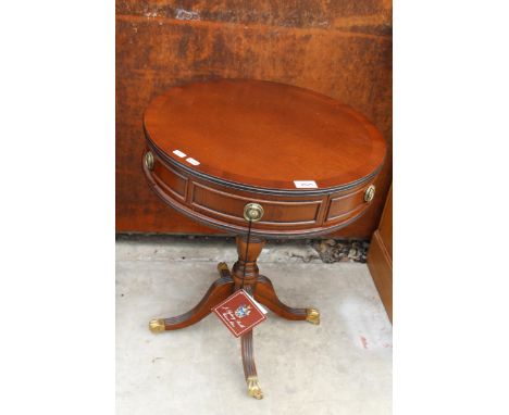 A MAHOGANY AND CROSSBANDED DRUM TABLE BY J. SYDNEY-SMITH ENCLOSING TWO DRAWERS 19.5" DIAMETER, WITH ORIGINAL RECEIPT £154 (19