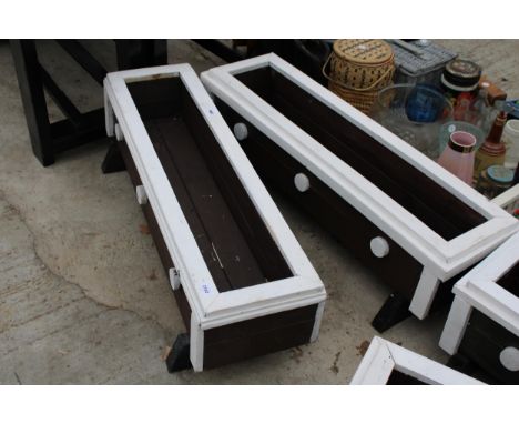 A PAIR OF WOODEN PAINTED GARDEN TROUGH PLANTERS 