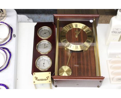 A METAMAC QUARTZ WALL CLOCK, A CARRIAGE CLOCK AND A BAROMETER, CLOCK AND THERMOMETER IN A WOODEN FRAME 