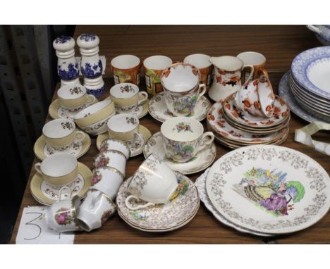 A MIXED LOT OF TEAWARE TO INCLUDE CUPS, SAUCERS, SIDE PLATES. CAKE PLATES, CREAM JUG SUGAR BOWL ETC 