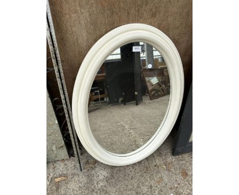 A WHITE FRAMED OVAL MIRROR 