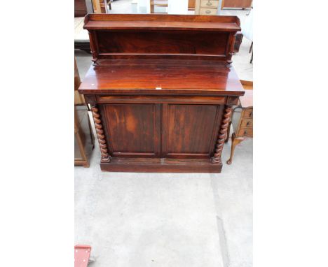 A VICTORIAN ROSEWOOD CHIFFONIER ENCLOSING TWO CUPBOARDS WITH BARLEY-TWIST COLUMNS, FRIEZE DRAWER AND RAISED BACK, 48" WIDE 