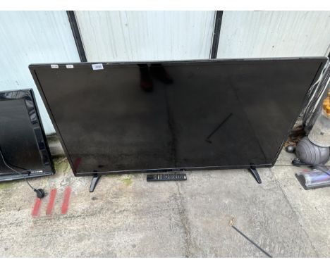 A POLAROID 50" TELEVISION WITH REMOTE CONTROL 