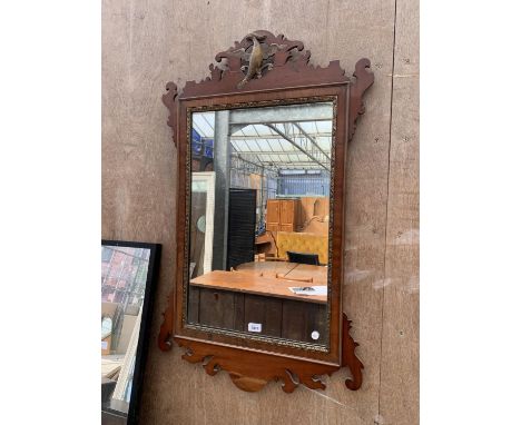 A MAHOGANY MIRROR WITH BRASS INNER BORDER 