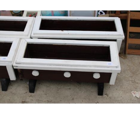 A PAIR OF WOODEN PAINTED GARDEN TROUGH PLANTERS 