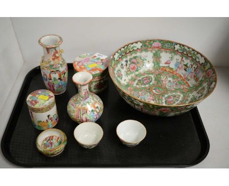 A 20th C Chinese Famille Rose circular bowl, decorated with alternating panels of figures and birds upon foliage, 26cms diame