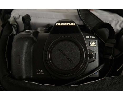 An Olympus E-510 Digital SLR camera, with tripod and accessories, contained together in a Lowepro camera bag.  