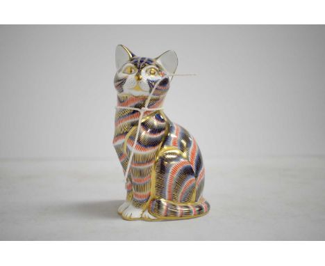 A Royal Crown Derby ceramic paperweight, in the form of a seated cat, with stopper to underside, 13cms high.