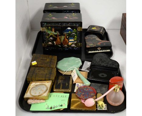 A selection of black lacquered Japanese style boxes, comprising: two miniature chests; a lidded box; and a trinket box formed