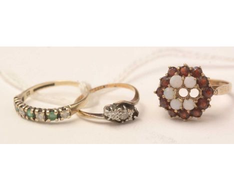 Three gold and yellow-metal gem set rings, including a garnet and opal cluster on 9ct gold, a diamond and yellow-metal ring s