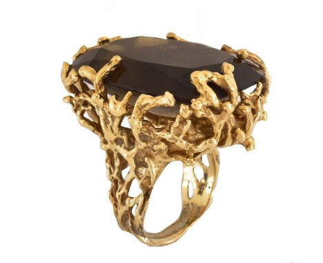 Large Smokey Topaz and 14 Karat Yellow Gold Ring. Topaz measures 29mm x 22mm. Stamped 14K. Ring size 6-1/2. Approx. weight: 2