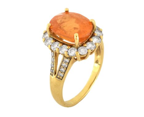 Oval Cut Citrine, Round Brilliant Cut Diamond and 18 Karat Yellow Gold Ring. Citrine with vivid color. Stamped 18K. Ring size