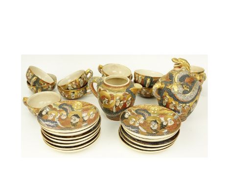 Twenty Five (25) Piece Antique Japanese Satsuma Porcelain Tea Service. Includes: 11 cups, 12 saucers, creamer, and sugar. Sig