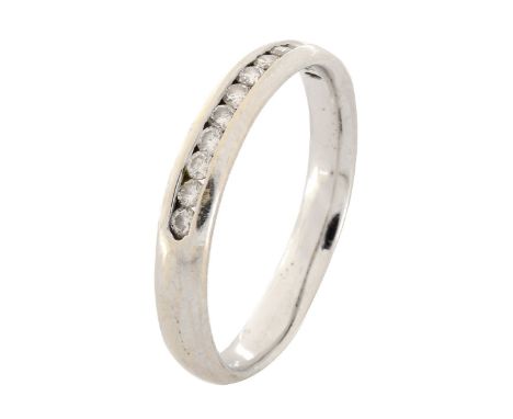 Vintage Diamond and 14 Karat White Gold Wedding Band. Unsigned. Ring size 8. Approx. weight: 3.0 grams. Condition: Good vinta
