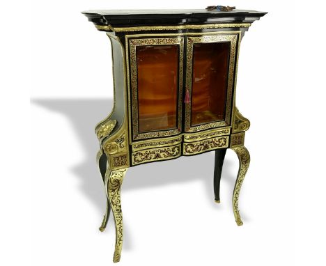 20th Century Louis XV Boulle Style 2 Piece Vitrine. Decorated with gilt bronze figural mounts. Beveled glass doors. Unsigned.