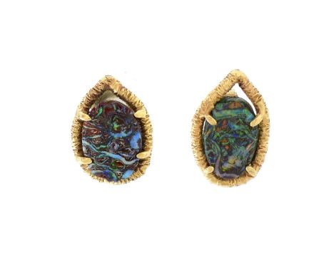 Free Form Black Opal and 14 Karat Yellow Gold Earrings. Unsigned. Measure 5/8" x 3/8". Approx. weight: 3.7 grams. Condition: 