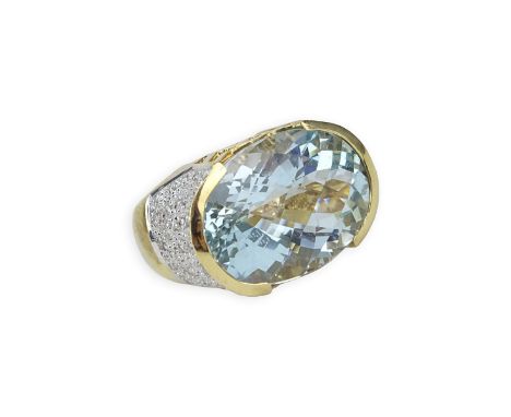 Oval Criss Cross Cut Aquamarine, Pave Set Diamond and 14 Karat Yellow Gold Ring. Aquamarine measures 18mm x 14mm. Stamped 14K