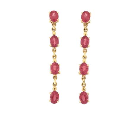 Vintage Oval Cut Ruby and 14 Karat Yellow Gold Earrings. Stamped 14K. Measure 2-1/8" L, 1/4" W. Approx. weight: 7.5 grams. Co