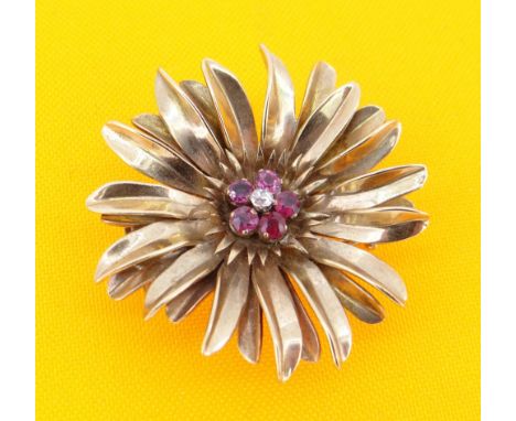 YELLOW METAL DIAMOND &amp; RUBY FLORAL BROOCH, the small central diamond surrounded by five rubies, 16.2gms, 41mm diam.Proven