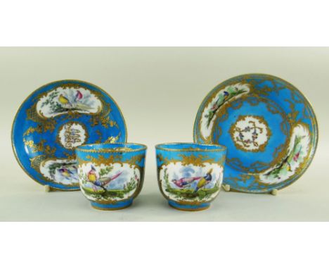 TWO SEVRES-STYLE PORCELAIN BLEU CELESTE TEA CUPS AND SAUCERS, 19th Century or later, decorated with with raised tooled gilt r